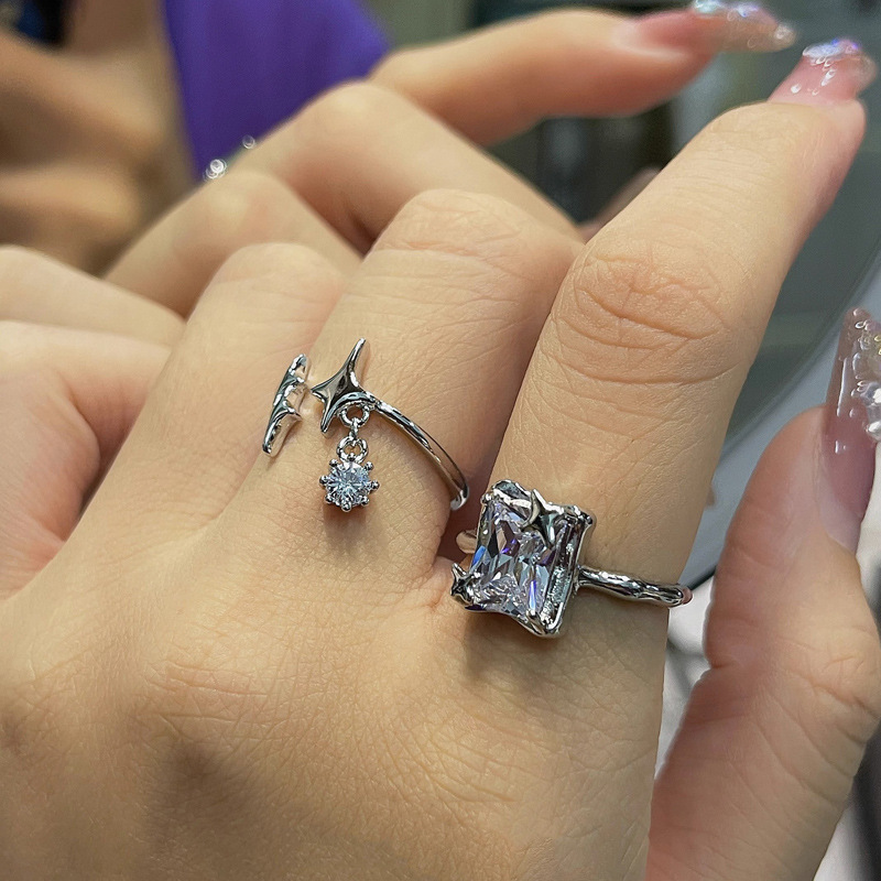 This is a niche design of a square sugar zircon star-tipped open ring with a cold tassel style. It is a versatile ring that exudes a sense of luxury and sophistication when worn in layers Specification drawing