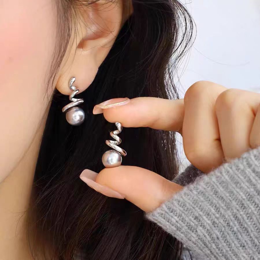 Fashionable and exquisite chanel-style pearl stud earrings with a spiral design exude a sense of high-end quality. Light luxury and niche style, versatile earrings full figure