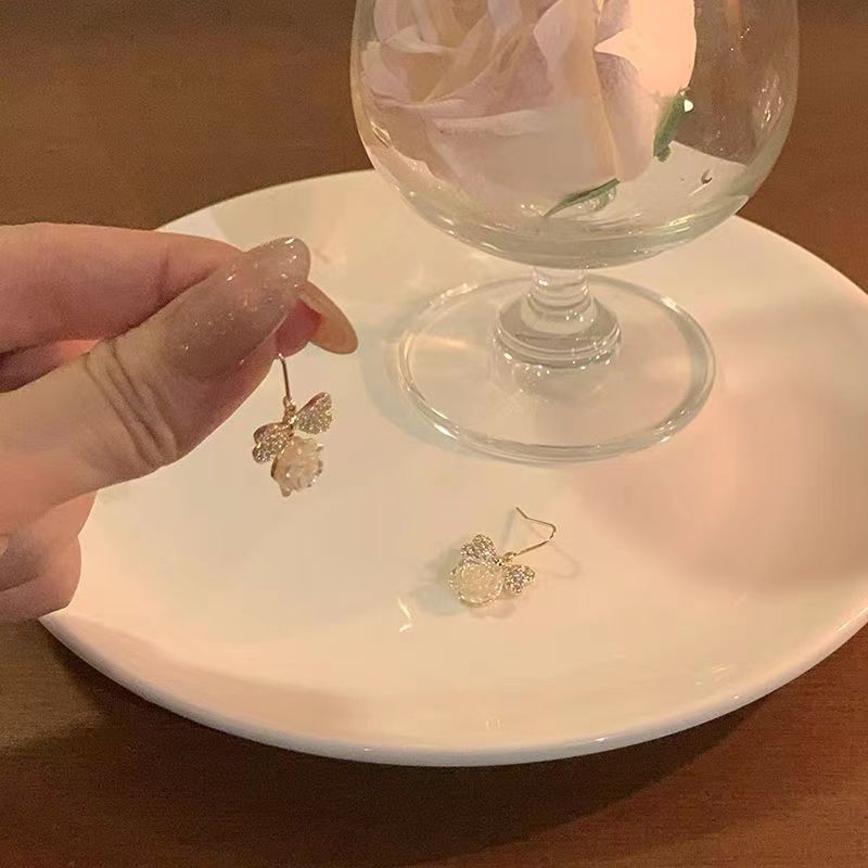 Diamond-encrusted bow camellia earrings for women, with a light luxury and niche style. The stud and hook design gives a sense of high-end earrings for women Application Scenario