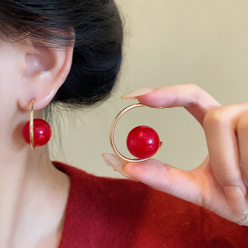 Red unique earrings, a new bestseller for women in autumn and winter, with a light luxury style and a high-end feel. The ear studs are niche and exaggerated New Year earrings details Picture