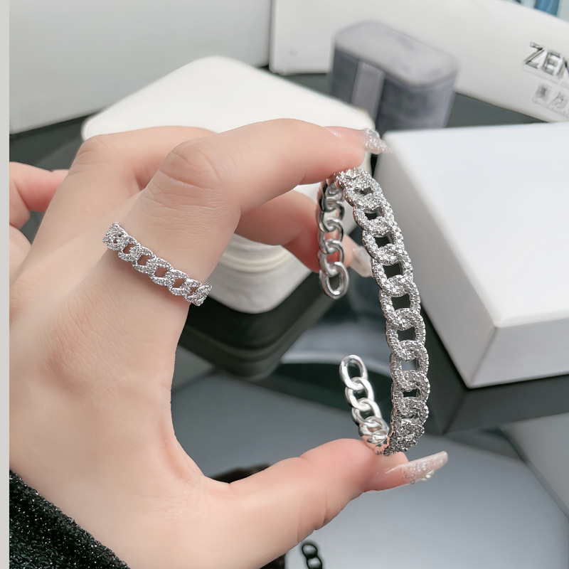This is a stylish and unique Japanese and Korean hollowed-out chain full diamond bracelet and ring that is versatile for women, exuding a sense of light luxury and high-end elegance full figure