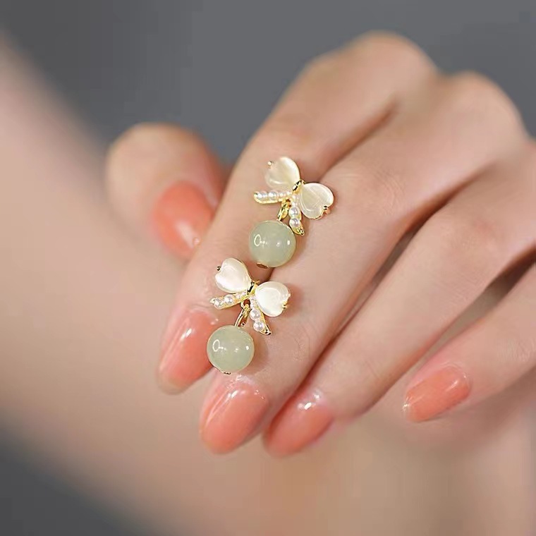 Light luxury and gentle temperament, cat's eye stone bow stud earrings for women, a new style of trendy ancient design earrings in 2025 full figure