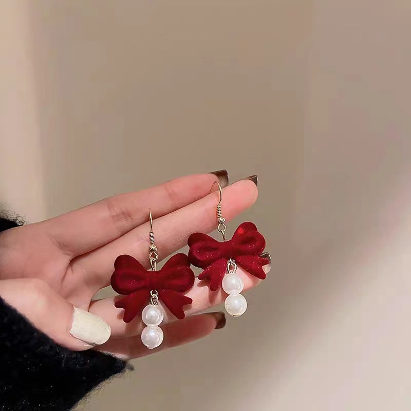 New Year earrings, festive earrings for the Spring Festival, niche design sense, high-end red flocked velvet bow, autumn and winter stud earrings Application Scenario