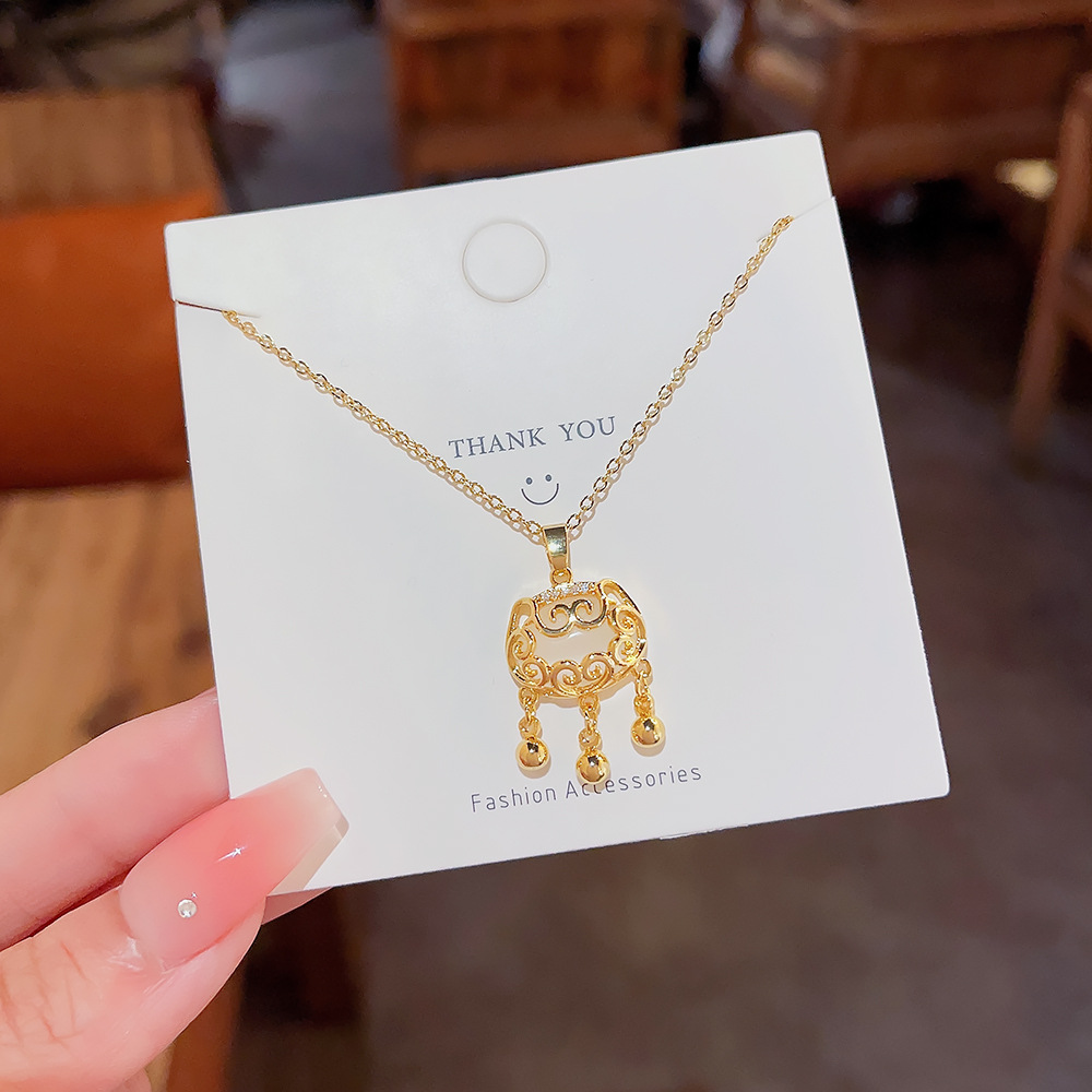 Xiangyun cat's eye stone Peace Lock National Trend style pendant, niche design, high-end feel, titanium steel necklace, women's collarbone chain wholesale full figure