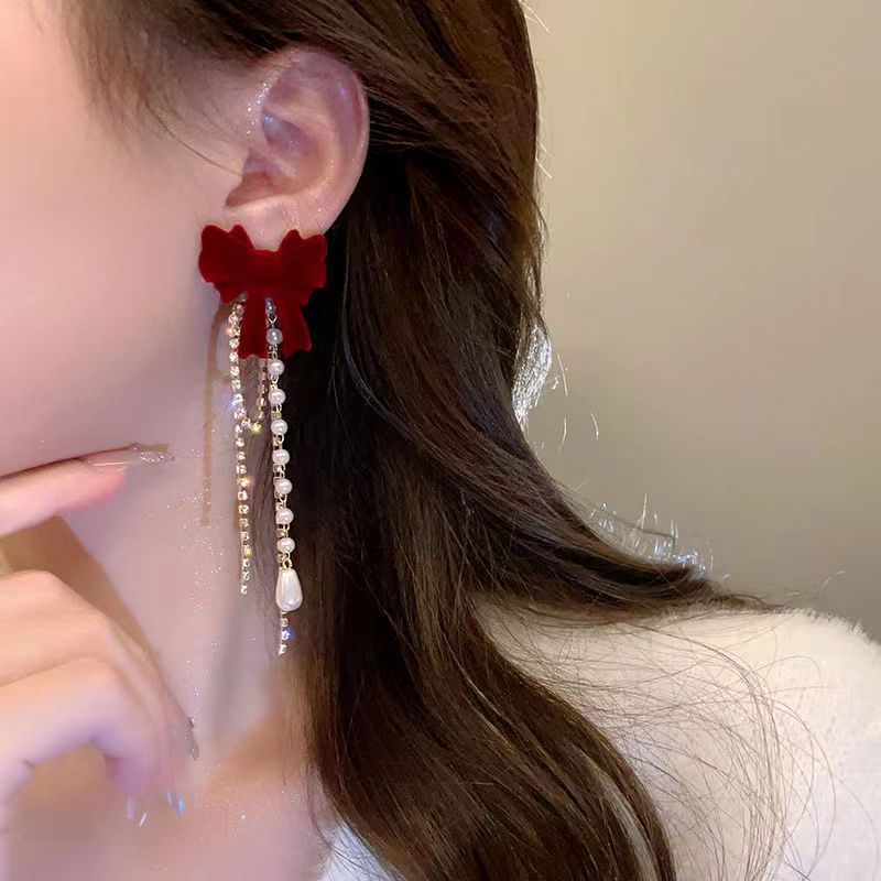 Long tassel flocked bow stud earrings for women, light luxury, fashionable, versatile, high-end and elegant ladylike earrings, a new trend details Picture