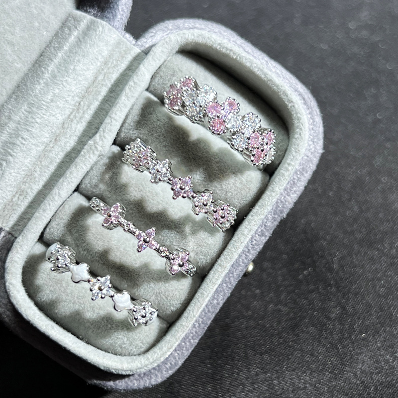 Exquisite and simple four-leaf clover slightly set pink diamond fashionable open ring, sweet and elegant woman, niche and cold style index finger ring full figure