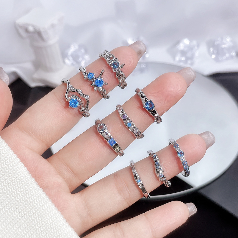 A light luxury and high-end sea-blue zircon open ring for women on Instagram, with a cold style, sweet and cool, irregular texture, and a trendy index finger ring full figure
