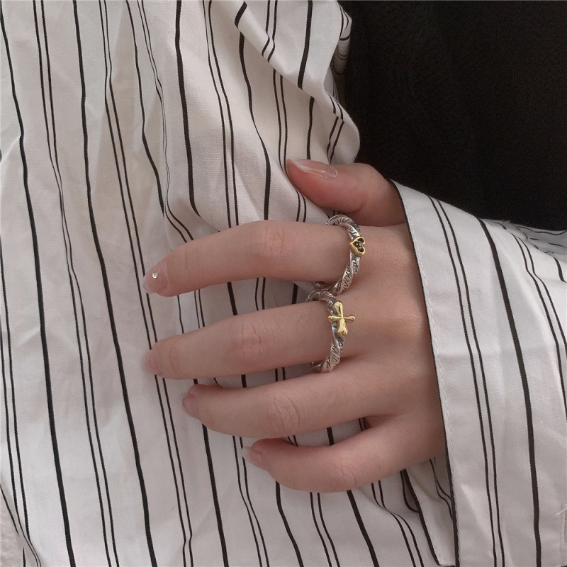 A retro distressed ring with a unique design of graffiti, a heart-shaped cross, and distorted English letters. It's versatile and trendy for dancing parties details Picture