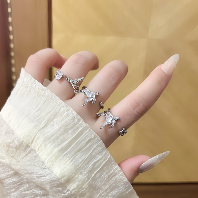 This is a minimalist and versatile ring with a unique design sense, irregular texture, swallow wings, pleated openings, and a gender-neutral style for women details Picture
