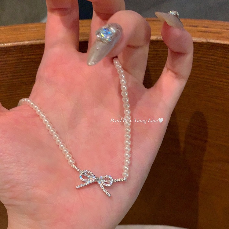 Wholesale of 2024 new style pearl bow necklace with a light luxury and niche design sense, sweet collarbone chain Specification drawing