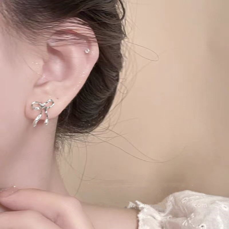 Minimalist silver bow stud earrings, a new bestseller in 2025, exudes a unique and elegant feminine charm Application Scenario