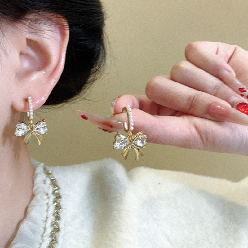 Dongdaemun, South Korea, bow-shaped zircon earrings, women's fashionable and high-end earrings, elegant diamond-encamed long earrings wholesale details Picture