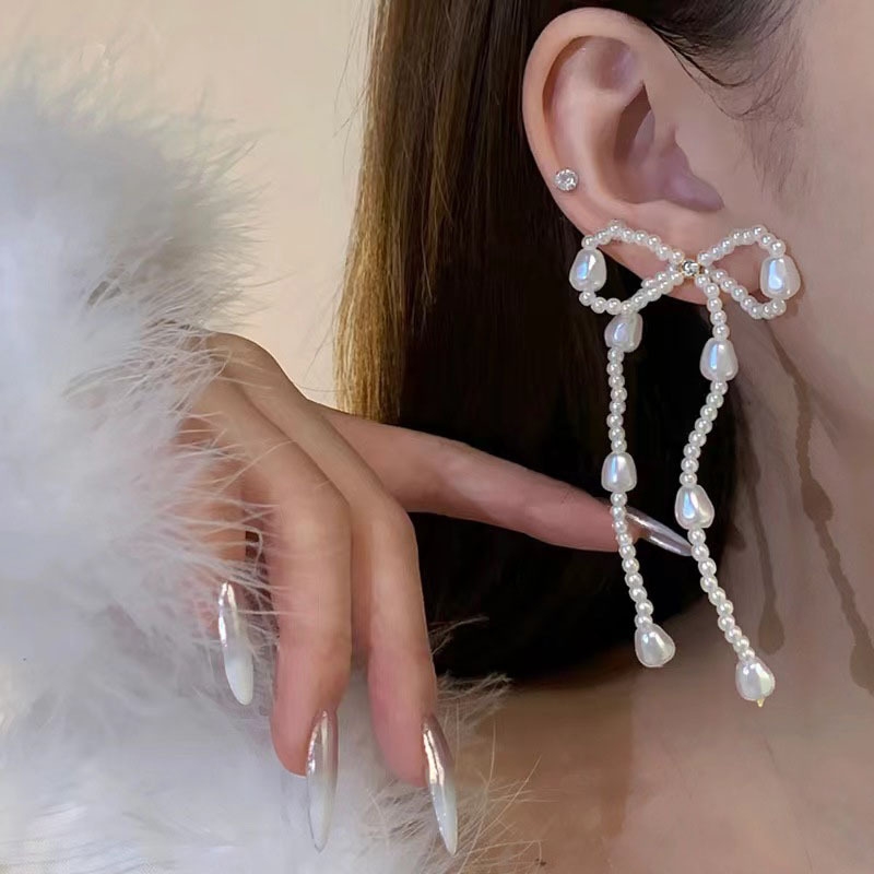 Pearl bow stud earrings, a new bestseller in 2025, are long tassel earrings with a light luxury, niche and high-end design full figure