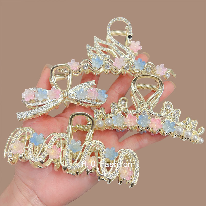 A new, elegant and sophisticated flower-shaped hairpin with a shark clip and a large female hairpin at the back of the head full figure