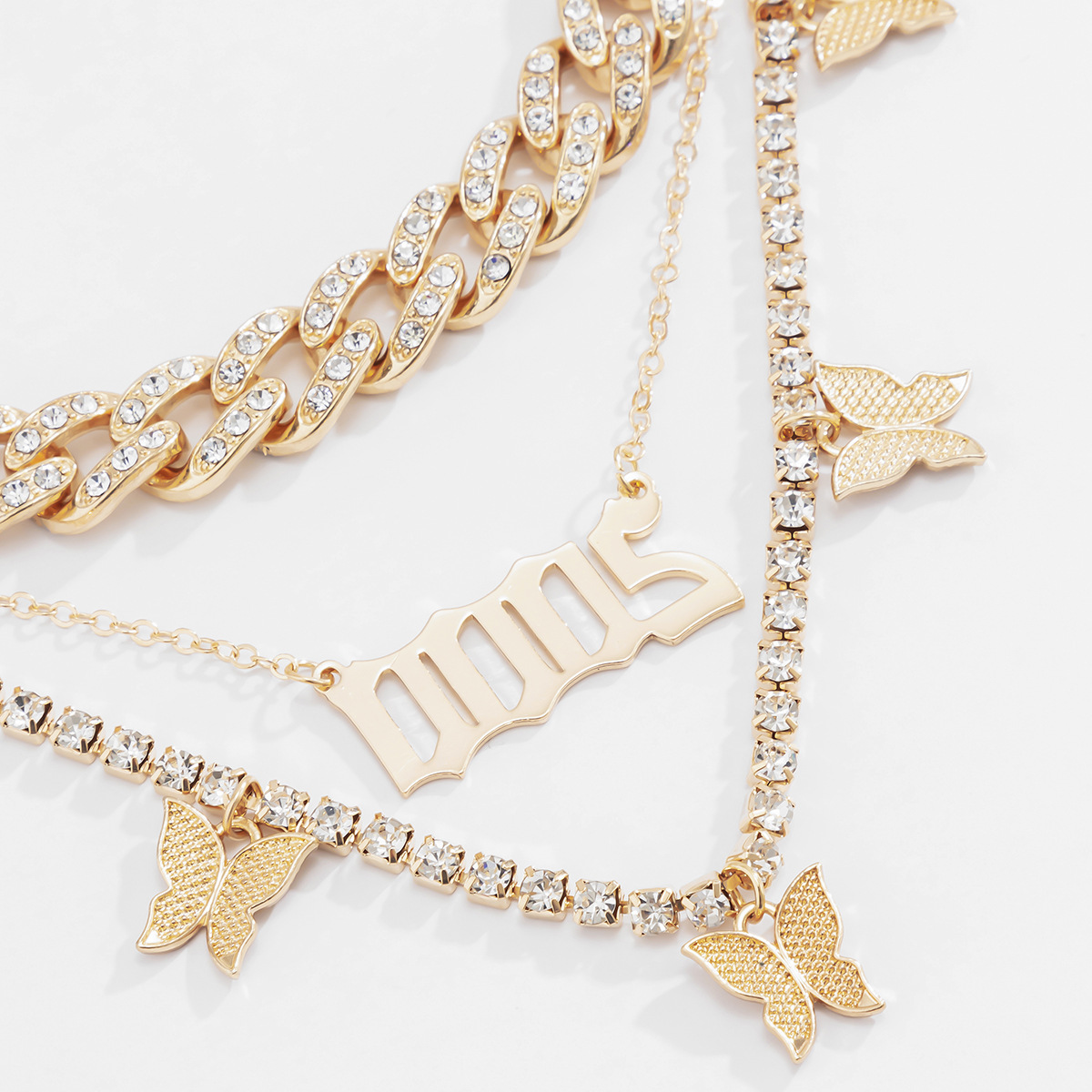 European and American cross-border jewelry, full diamond geometric Cuban chain, elegant collarbone chain, exaggerated letter tassel butterfly necklace Application Scenario