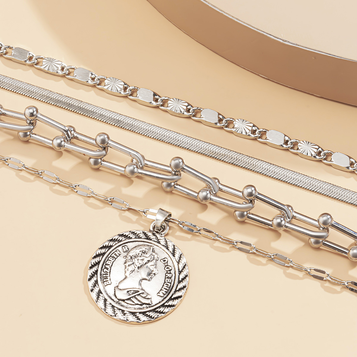 European and American cross-border jewelry, simple multi-layer snake bone U-shaped buckle chain necklace, women's retro circular pendant tassel necklace Application Scenario