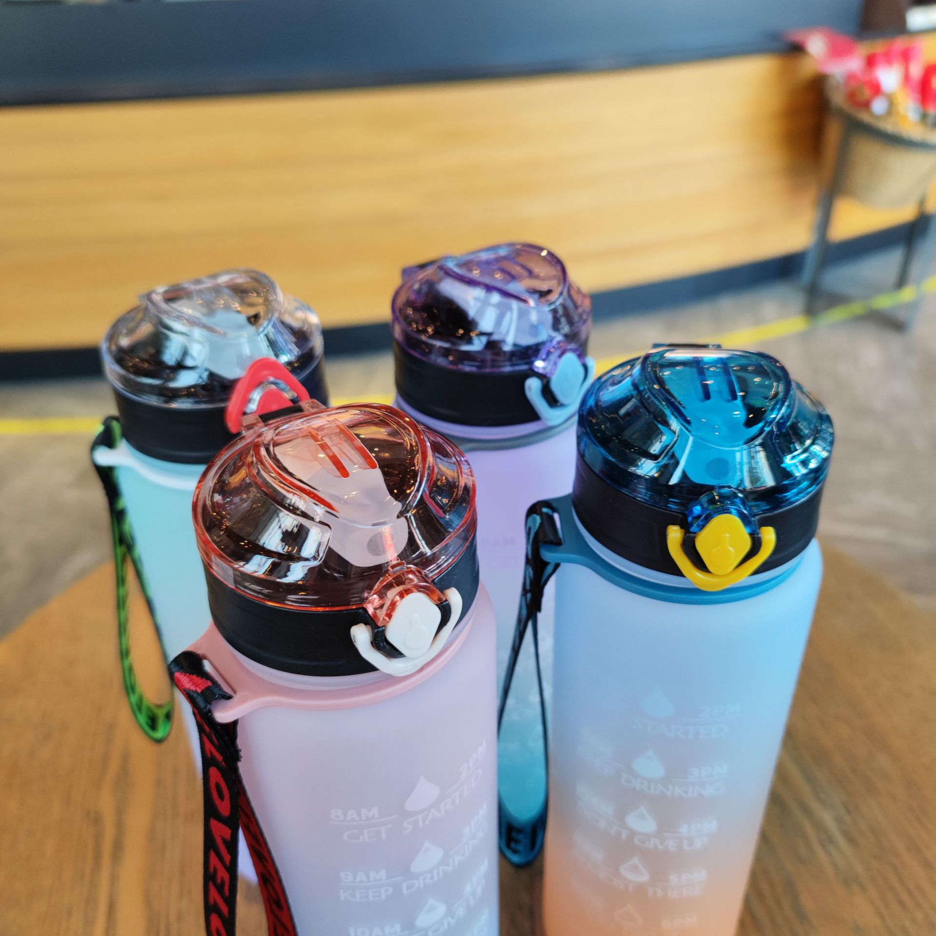 Large-capacity water bottle, gradient frosted duckbill shaped straw, portable rope, outdoor sports water cup 1000ml Application Scenario