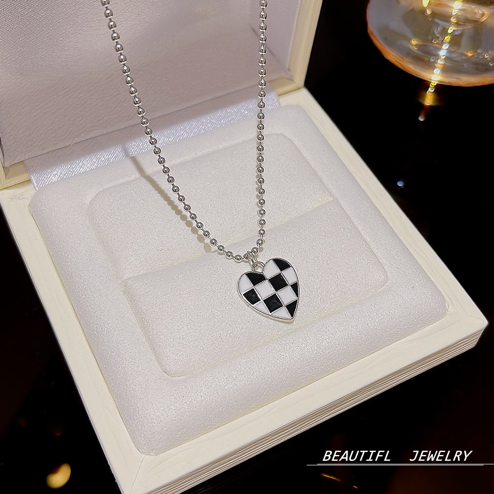 Stainless steel necklace with a high-end female feel, black and white heart-shaped chessboard pendant, light luxury, ins style collarbone chain, popular sweater chain details Picture