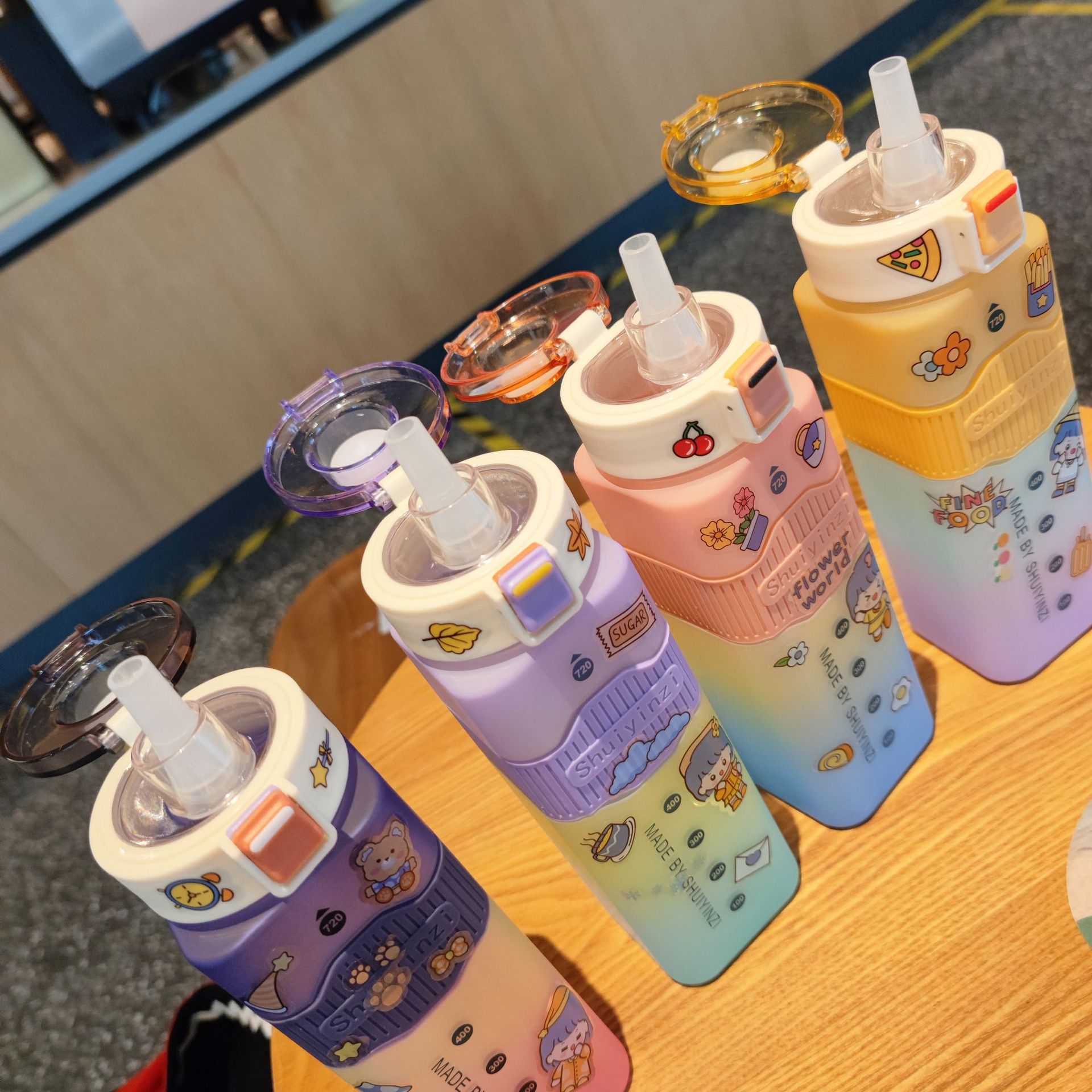 Wholesale of three-color rainbow gradient square sports straw plastic water cup, portable lifting rope, bouncing cap, graduated water bottle details Picture