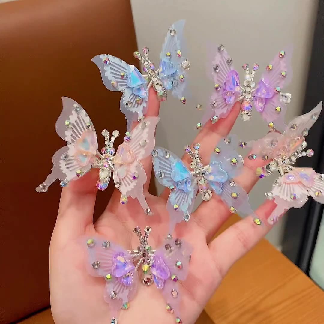 The moving butterfly hairpin can fly with diamonds. It's a super fairy child hair accessory. It's a children's butterfly hairpin. The female wings can move Specification drawing