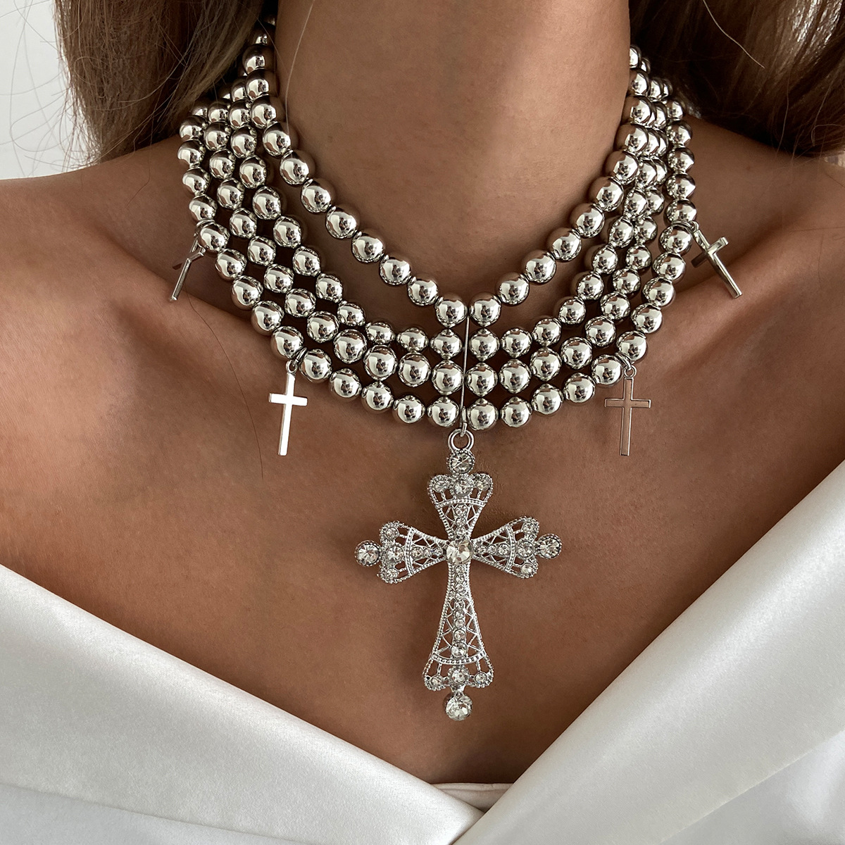 A multi-layered diamond cross necklace with a European and American light luxury style, featuring an exaggerated and unique charm. CCB round bead necklace details Picture