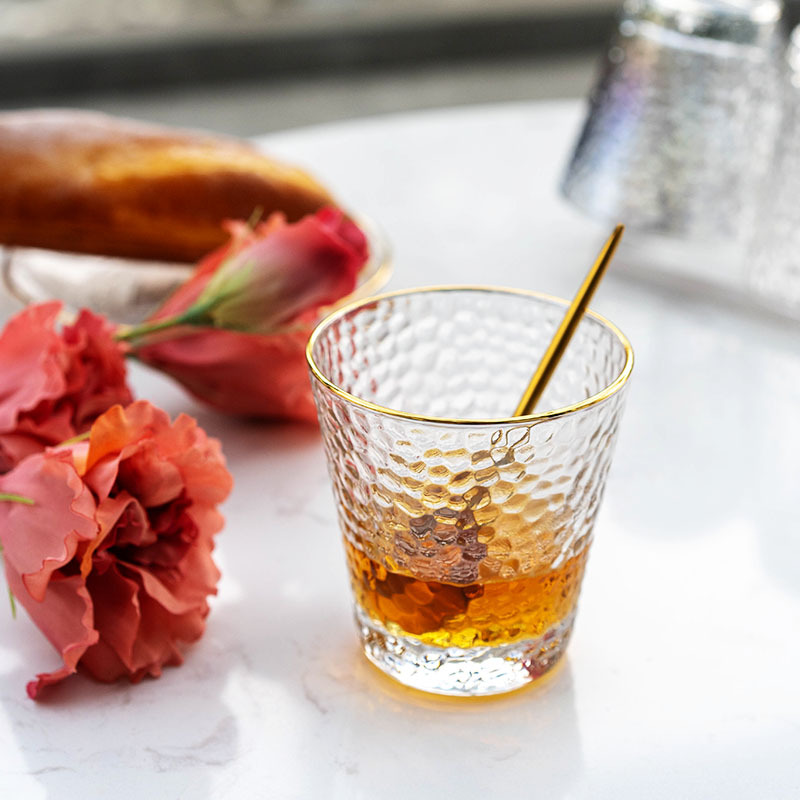 Relief glass cups, heat-resistant tea cups for restaurants, transparent gilded milk water cups, creative golden edge hammer-patterned cups wholesale details Picture