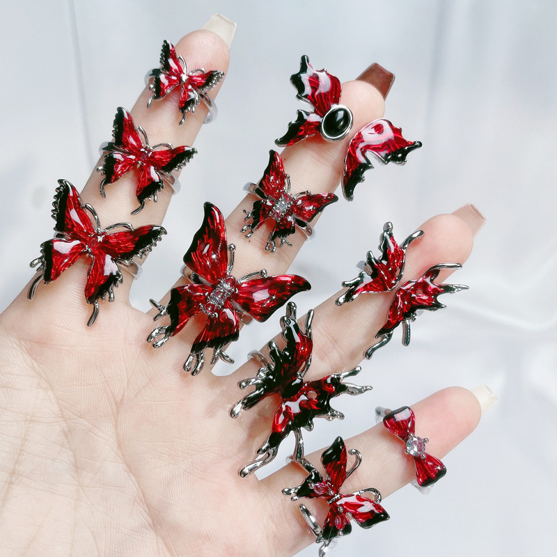 A sweet and cool red enamel drop glaze butterfly opening ring with a feminine charm, a unique and exquisite design, and a distinctive personality details Picture