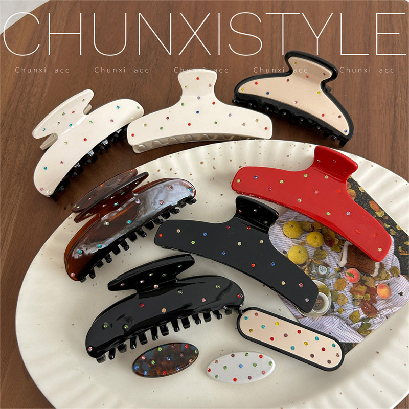 A new polka dot hair clip headwear featuring a sweet and cute Korean color diamond scratch-clip on the back of a woman's head and a stylish shark clip full figure