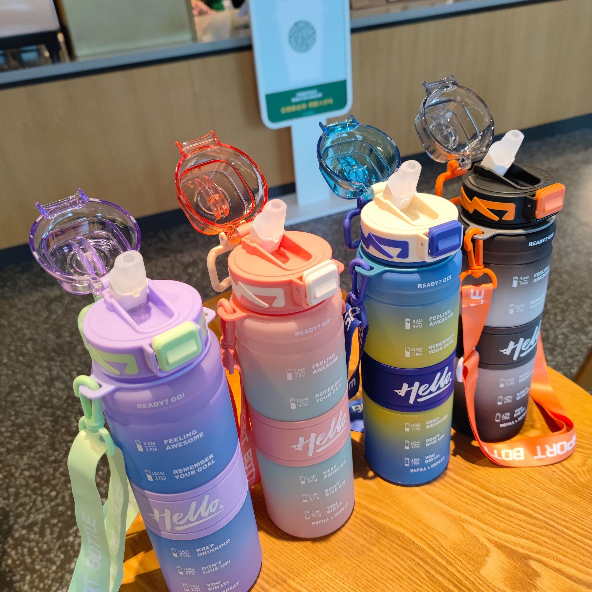 Wholesale 1000ml high appearance level straw cup, plastic water cup, portable shoulder strap straw water bottle, student gradient color water bottle full figure
