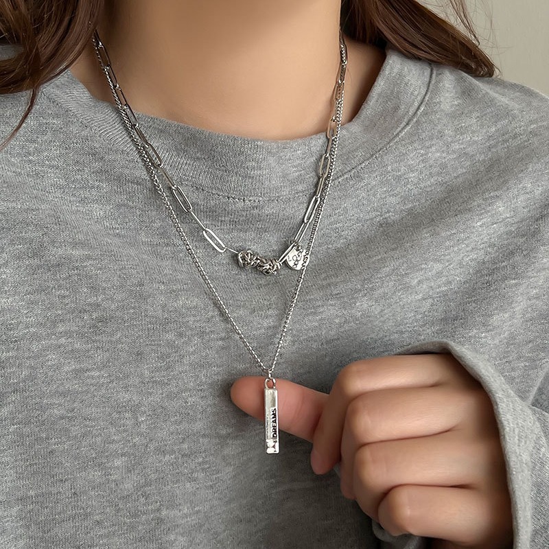 The design sense of double-layer layered wearing of a niche necklace gives a unique hip-hop sweater chain for women and a silver metal hoodie chain for men details Picture