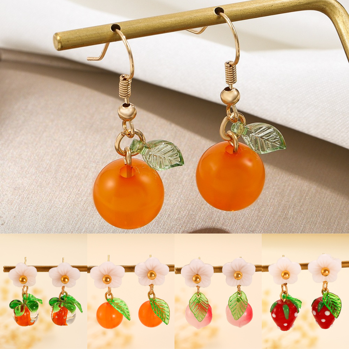 European and American Instagram creative orange fruit earrings, Japanese and Korean fashionable niche design kumquat earrings, sweet earrings for women full figure