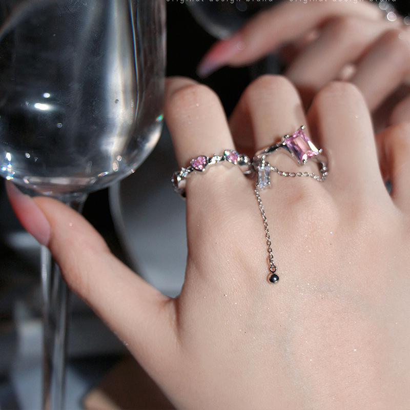 A pink zircon heart-shaped ring with square tassels and chain opening, a light luxury ring for women in INS 2022 new style Application Scenario