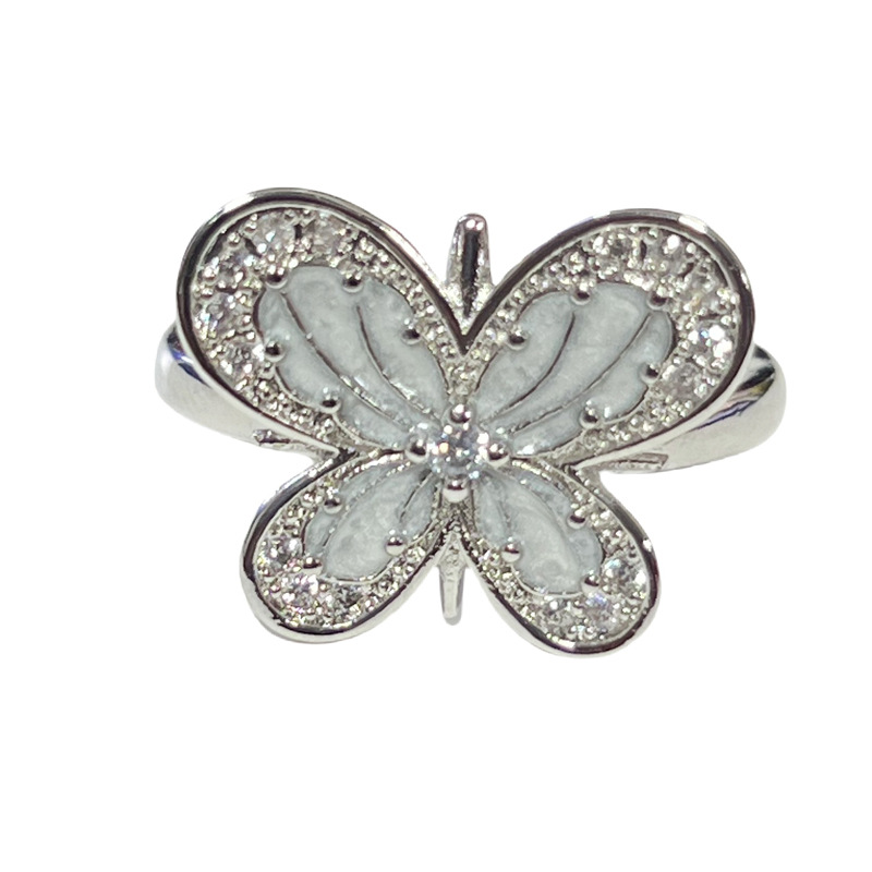 A sweet and cool white glazed butterfly Saturn fashion ring, a unique and simple geometric ring for women Item Picture