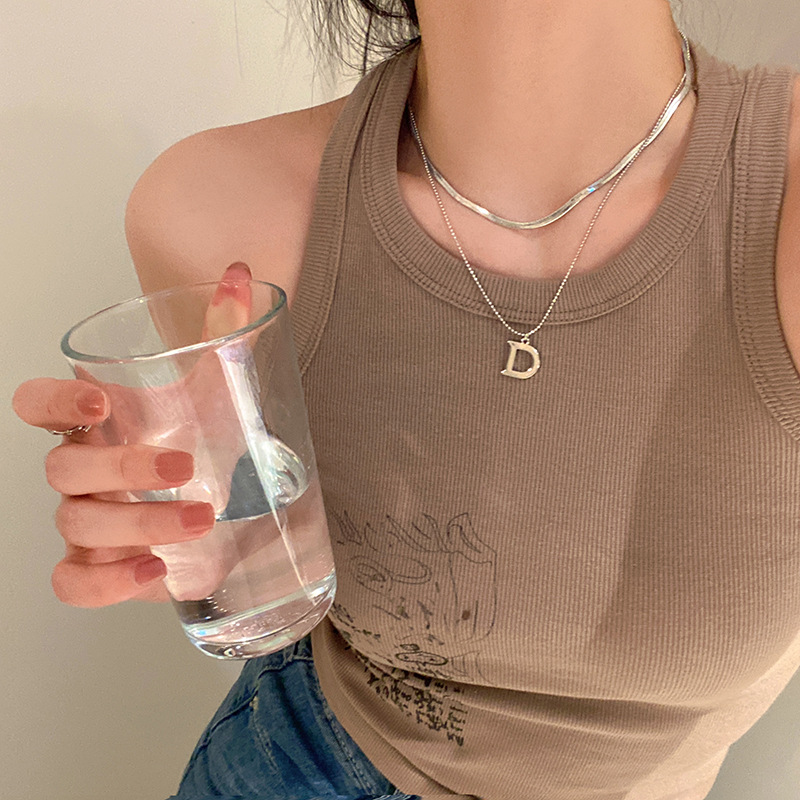 The letter D double-layer snake bone necklace for women, a light luxury and niche collarbone chain with a summer design sense, is a popular neckchain accessory full figure