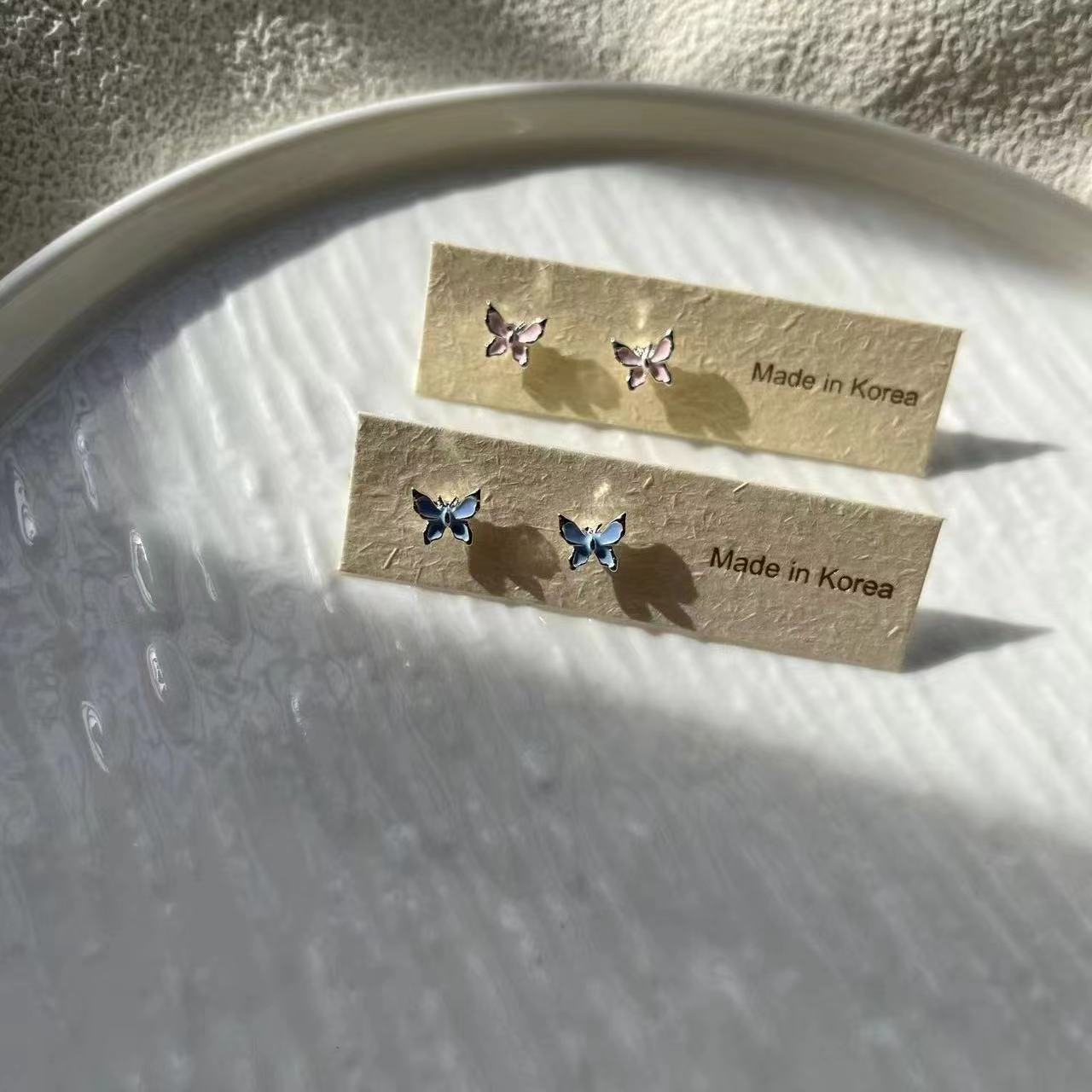 The new pink glazed butterfly 925 stud earrings are versatile, simple, and in a niche, exquisite, and fresh style details Picture