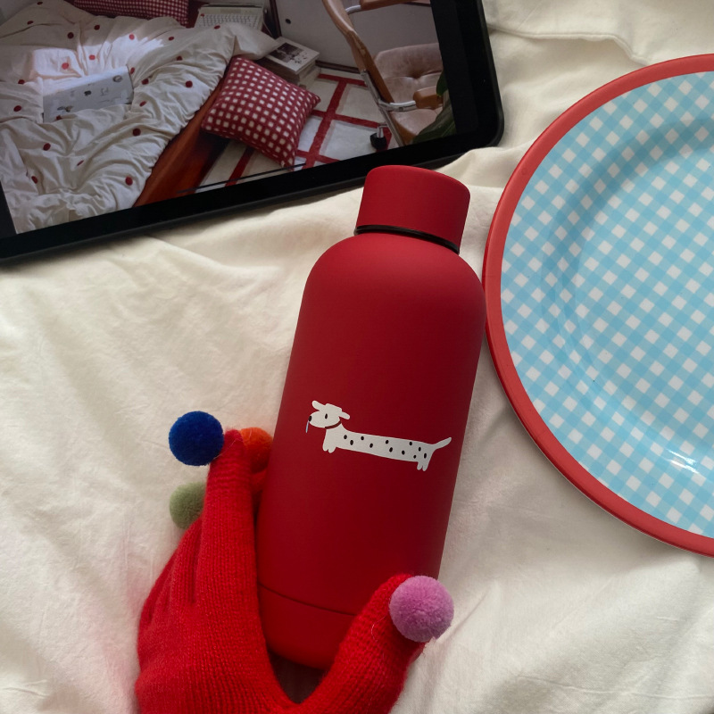 New Year and Christmas high-end red frosted stainless steel insulated cup for little dog, cute spotted dog travel cup Application Scenario