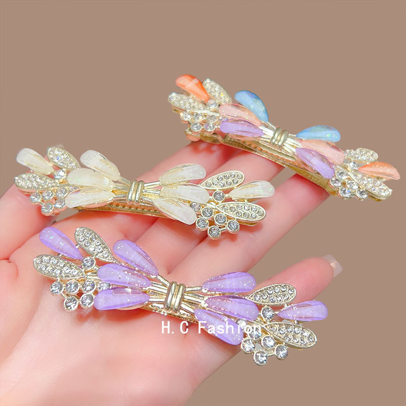 The 2025 new high-end crystal spring hair clip is elegant and feminine. It is a semi-coiled hair clip accessory for the back of the head full figure