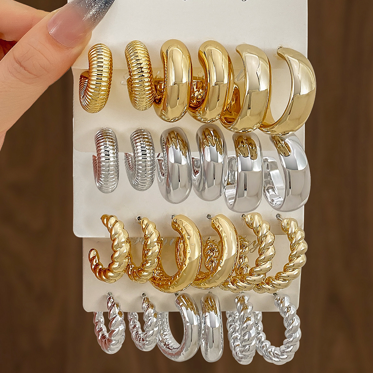A new set of 3 pairs of high-end gold and exaggerated ccb earrings with a unique twist pattern from Europe and America Specification drawing