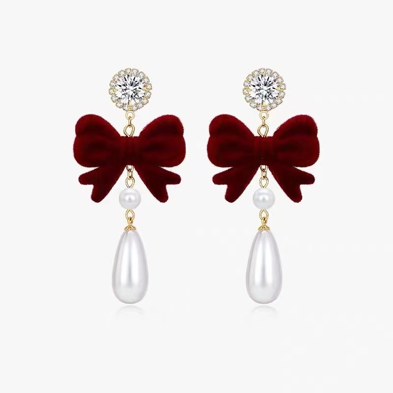 Wine red velvet bow pearl earrings exude a sweet and girlish charm. Long and high-end New Year earrings for autumn and winter Item Picture