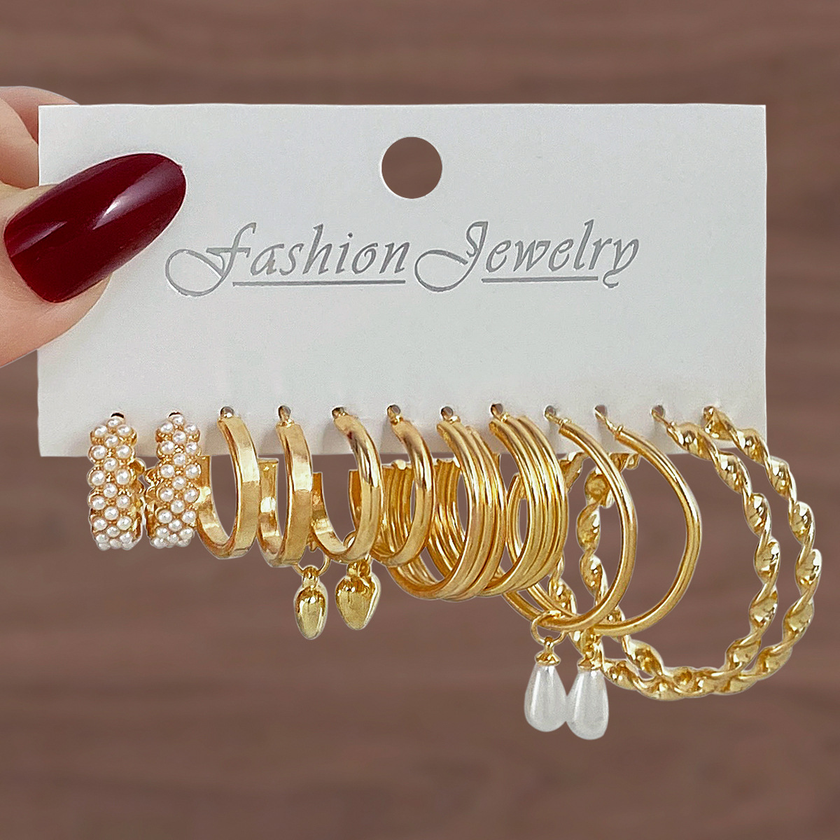 Cross-border best-selling European and American fashionable and simple earring set, versatile for women's temperament, with exaggerated and unique twist patterns and grand circles full figure