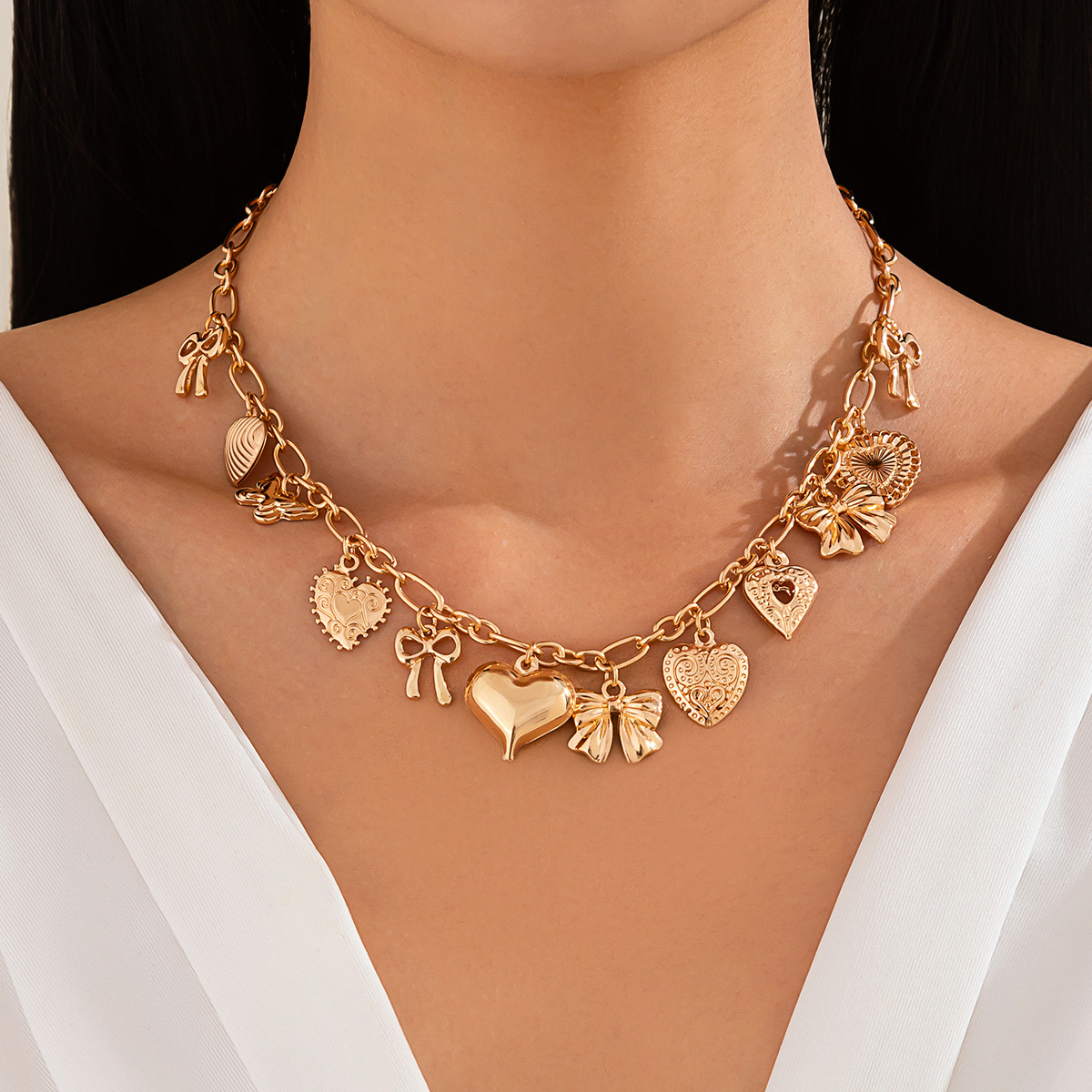 European and American cross-border jewelry punk style heart alloy pendant collarbone chain bow tassel necklace personality full figure
