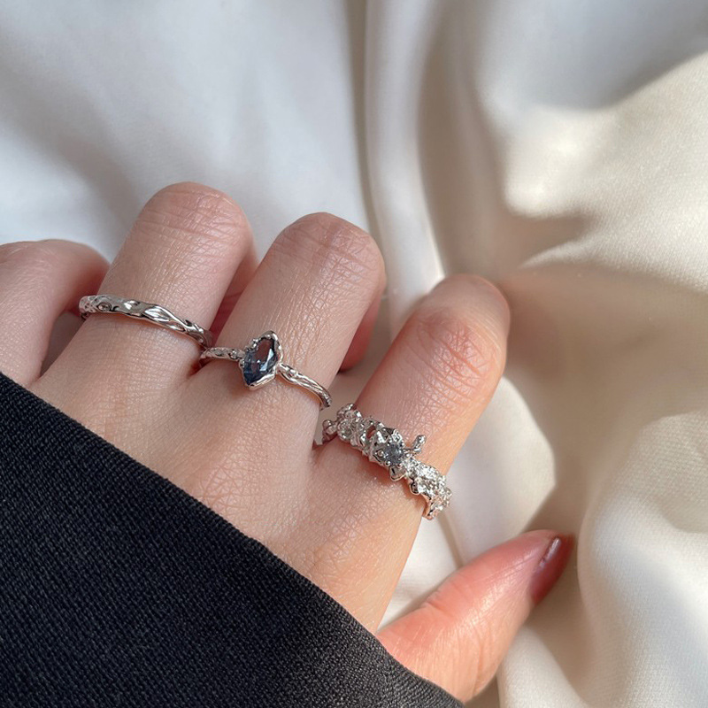 A niche design with an irregular texture and an open ring for women. A blue zircon sweet and cool style with a simple and unique personality details Picture