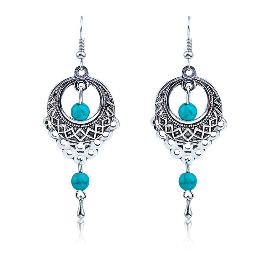 Wholesale of European and American fashion retro ethnic style hollowed-out turquoise water drop earrings and Bohemian tassel stud accessories full figure