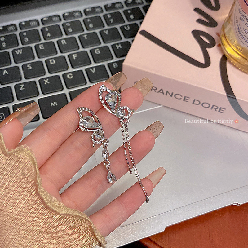 S925 Silver Needle Asymmetrical butterfly zirconia tassel earrings, a niche design with a high-end feel, are long and popular earrings on the Internet full figure