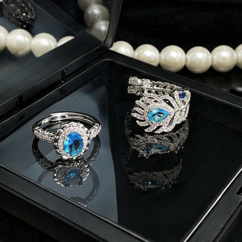 A niche design sense sea-blue zircon feather open ring for women, adorned with diamonds, a fashionable, individualistic and light luxury ring from Europe and America Application Scenario