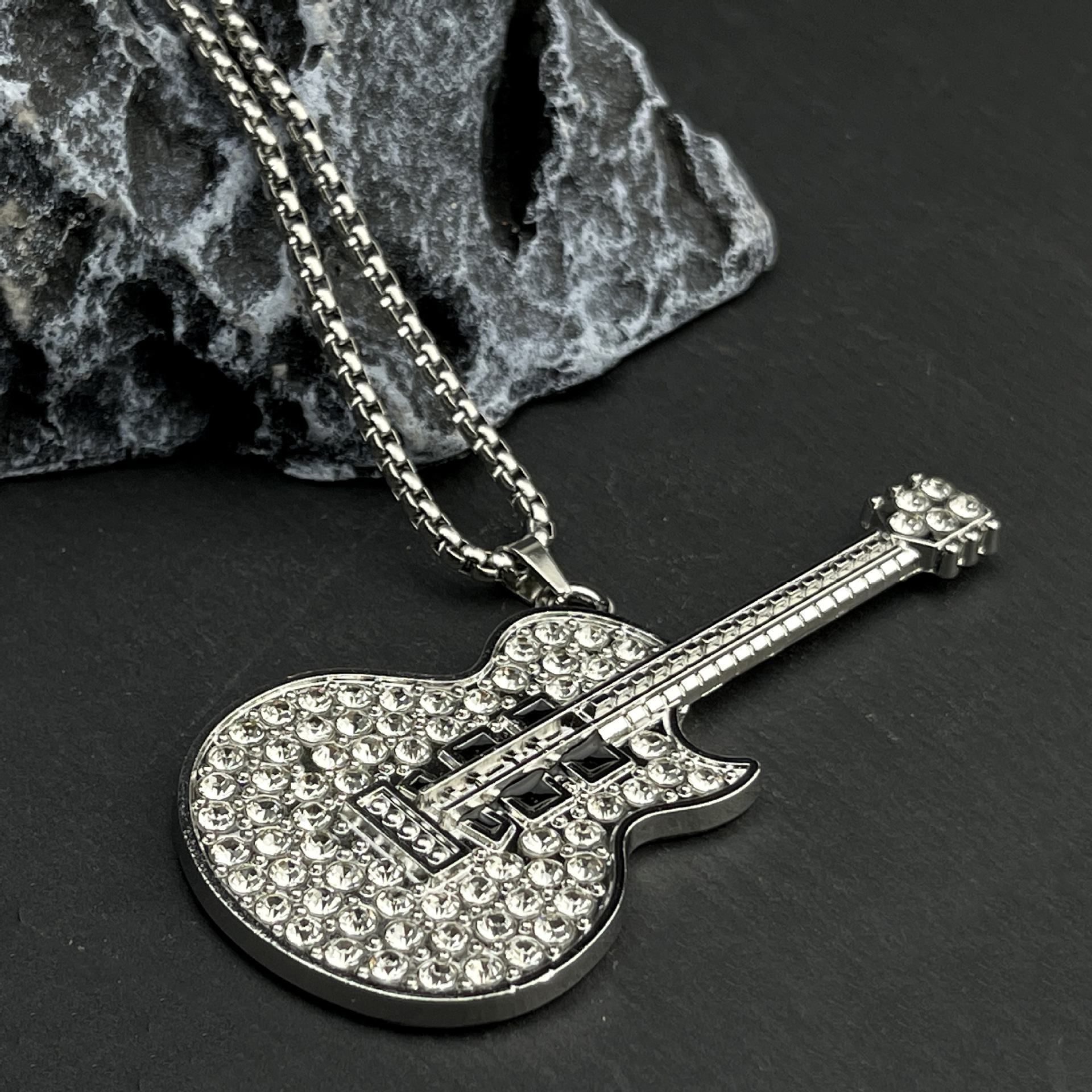 Wholesale of new European and American style personalized music guitar pendants, fashionable and niche full-diamond titanium steel necklaces for men and women details Picture