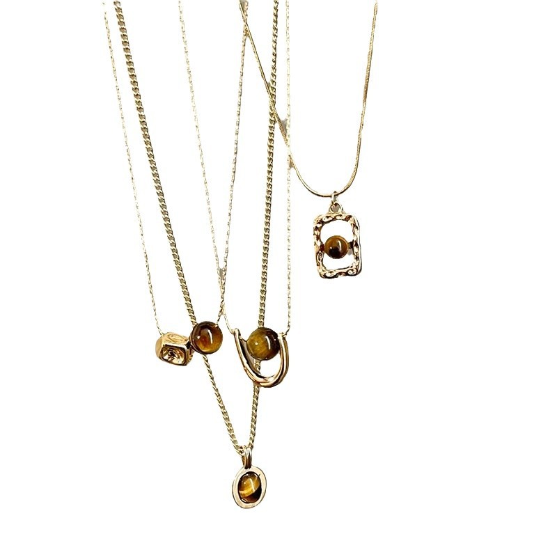 This U-shaped tiger's eye pendant necklace is a retro, elegant, light luxury and versatile necklace for women. It's a sweater chain Item Picture