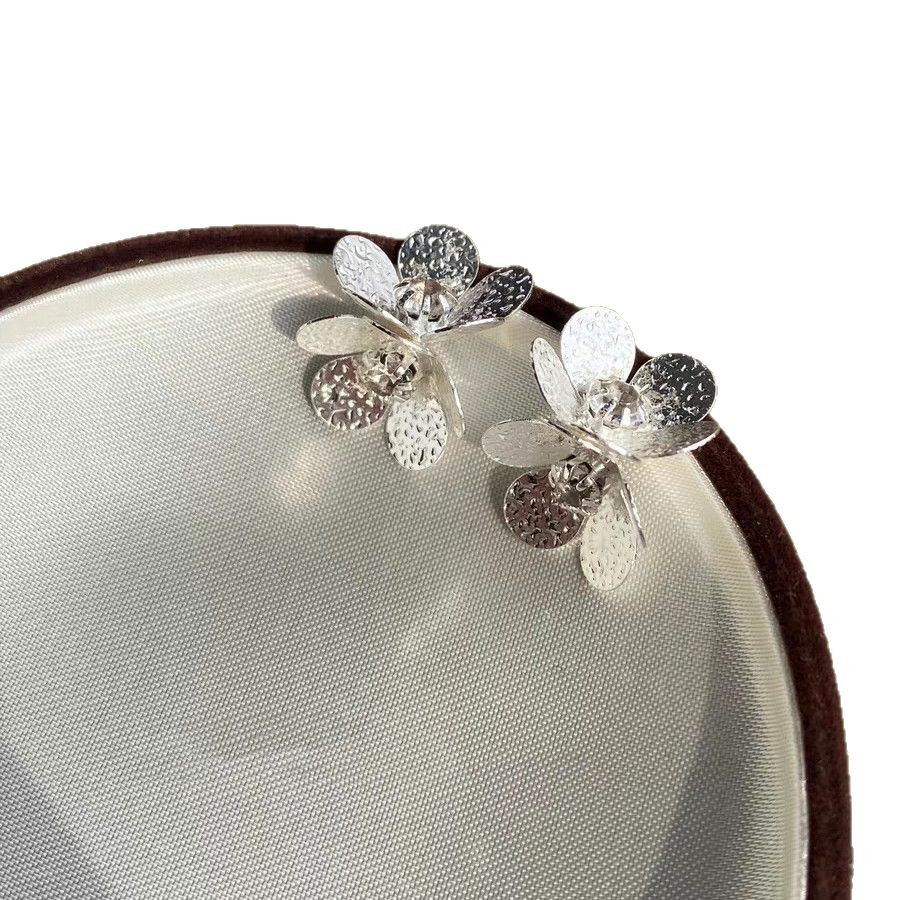 Luoshan Tea 2025 New style tin foil textured zircon flower stud earrings, Korean-style delicate and cold style earrings Item Picture