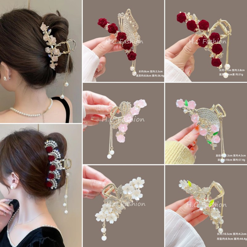 The new elegant chanel-style hair clip exudes a sweet and feminine charm. It features a rose flower grab clip, a stepping tassel, and a shark clip full figure