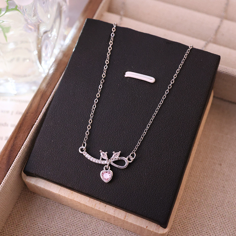 Exquisite and light luxury bow zircon heart titanium steel necklace, a versatile, niche and high-end collarbone chain fashion accessory for women Application Scenario
